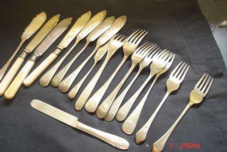 ODD FISH KNIVES AND FORKS SOME POSSIBLY SILVER