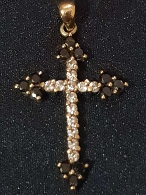 9ct gold cross  with black and white stones