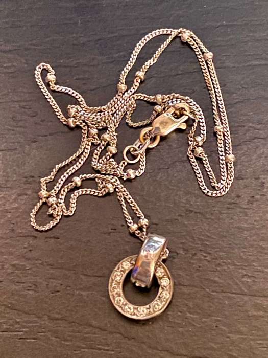9ct white gold chain with a 9ct white gold and diamond Halo pendant