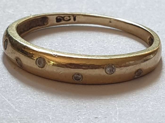 9 ct gold ring with 6 small Cubic Zirconia`s