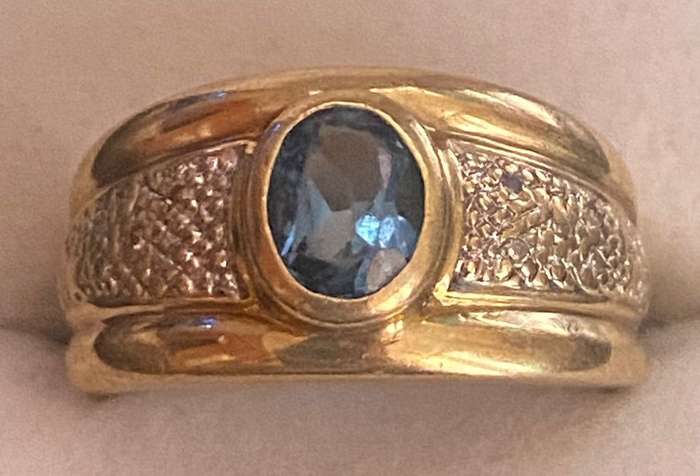 Diamond and Blue Oval Topaz Ring set in 9ct yellow gold