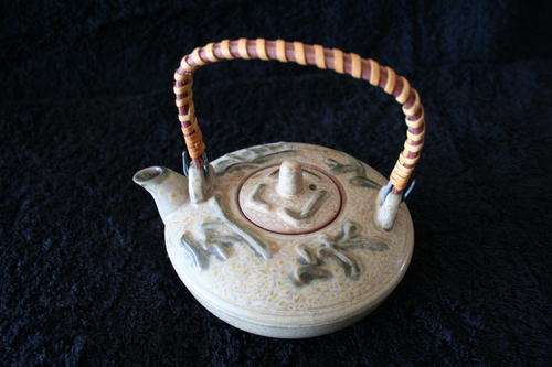 POTTERY GLAZED KETTLE WITH RATTAN HANDLE--VERY CUTE