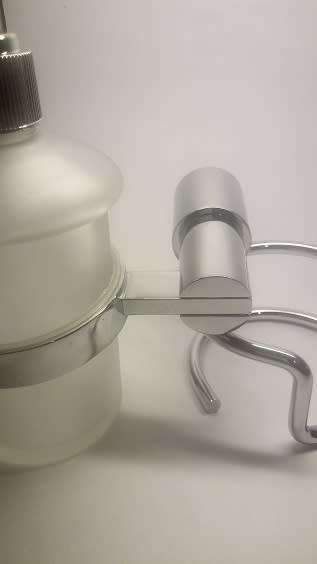 SOAP DISPENSER. BATHROOM WALL