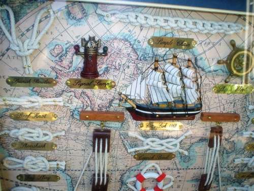 Beautiful framed knots of the sea, old ship and other ship items framed behind glass