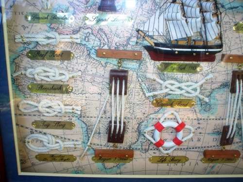 Beautiful framed knots of the sea, old ship and other ship items framed behind glass