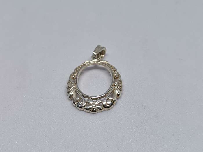 Detailed Silver Pendant
