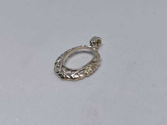 Detailed Silver Pendant
