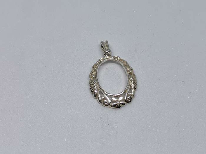 Detailed Silver Pendant