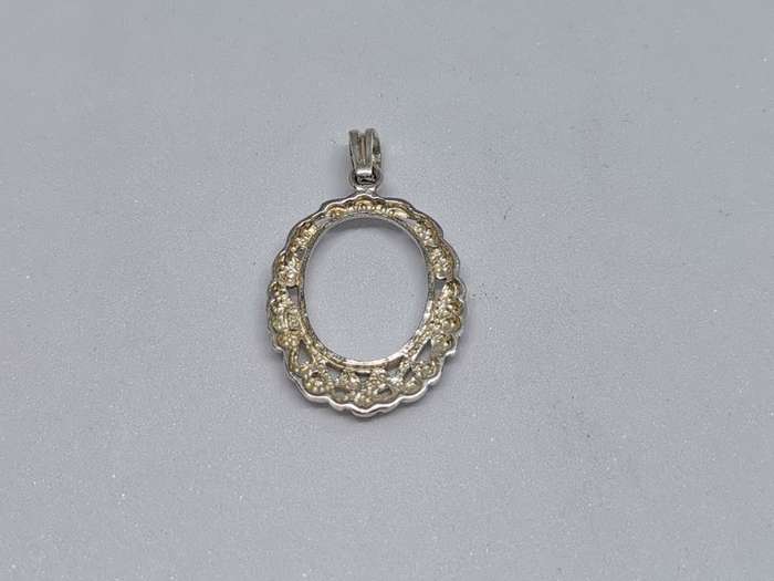 Detailed Silver Pendant