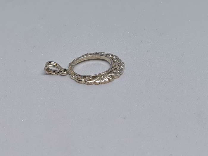 Detailed Silver Pendant