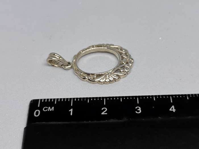 Detailed Silver Pendant