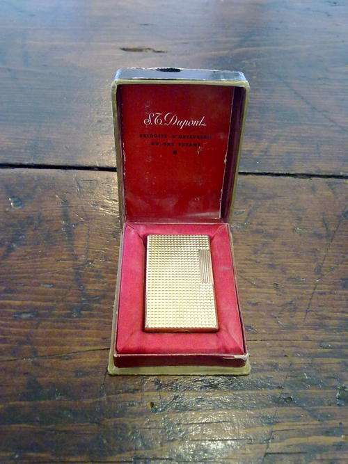 A Dupont lighter in original box with papers
