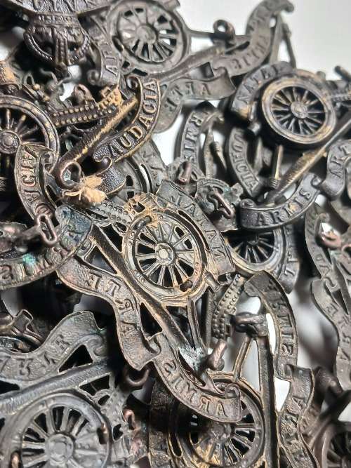 50 x  WW2 Natal Field Artillery cap badges ( PLEASE NOTE ALL LUGS AND PINS ARE DAMAGED )      Lot B