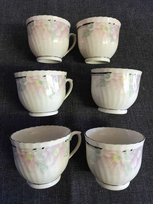 6 Floral porcelain tea cups with silver trim New