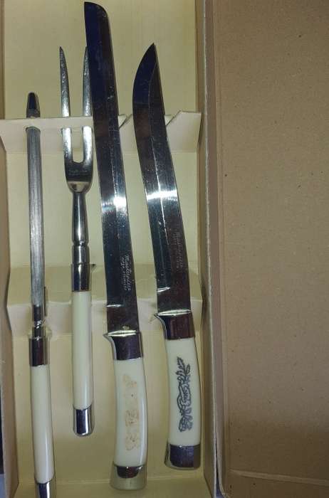 A 4 PIECE CARVING SET WITH WHITE INLAID HANDLE  MASTER PIECE STAINLESS STEEL
