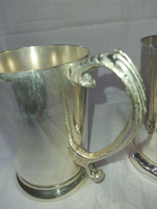 TWO SILVER PLATED SPORTING BEER VINTAGE MUGGS SOLD AS IS
