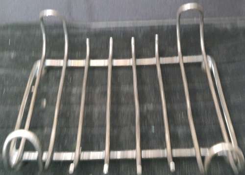 A COLLECTION OF 4 TOAST AND PLATE HOLDERS EPNS VINTAGE SOLD AS IS