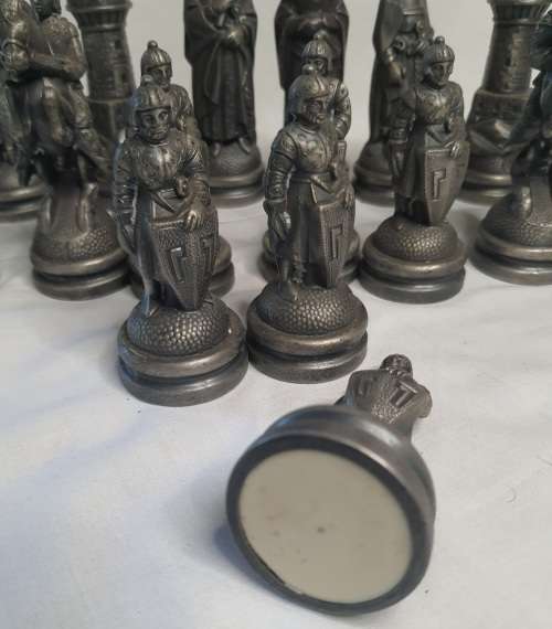 A  VINTAGE COLLECTION OF ALLOY CHESS PIECES , ITS NOT THE COMPLETE SET SOLD AS IS