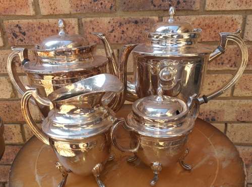 A VINTAGE SILVER PLATED TEA SET ,