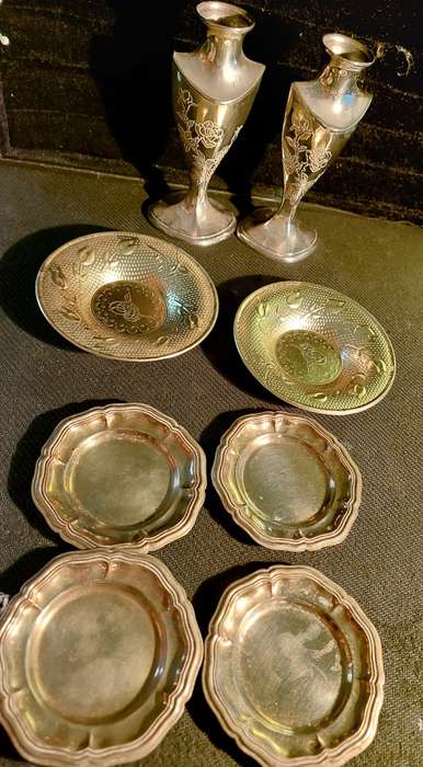 A collection of vintage utensils and a pair of silver-plated candle holders in good condition sold a