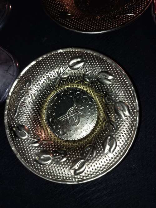 A collection of vintage utensils and a pair of silver-plated candle holders in good condition sold a