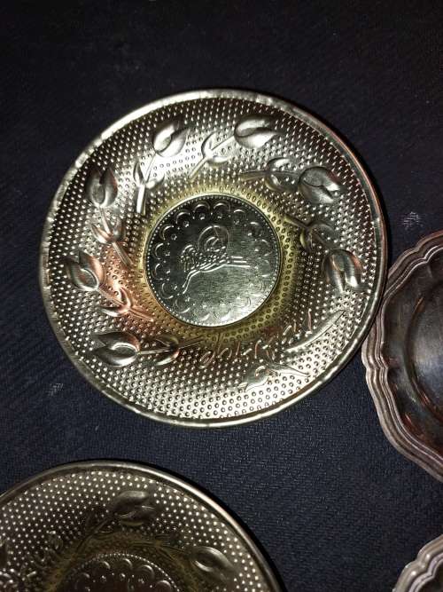A collection of vintage utensils and a pair of silver-plated candle holders in good condition sold a