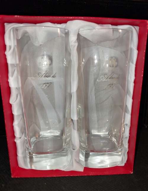 A pair of commemorative SAB beer glasses sold as is.
