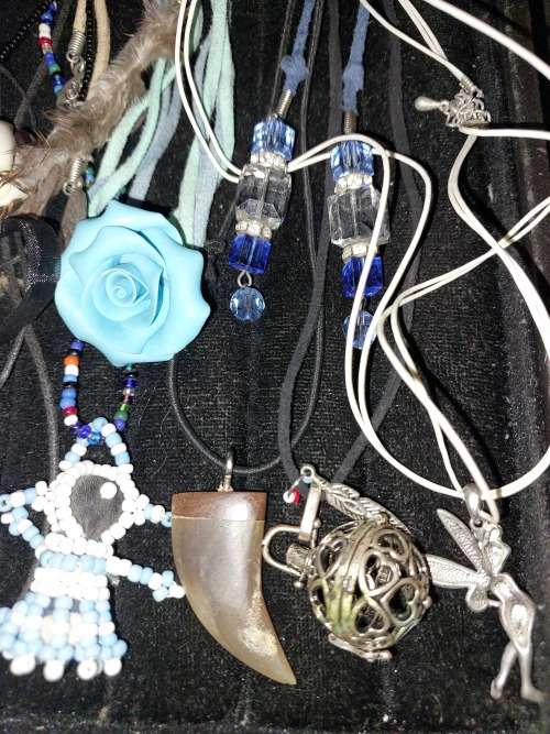A BULK COLLECTION OF LEATHER ROPE COSTUME NECKLACES SOLD AS IS