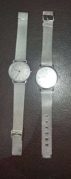 TWO CK SILVER PLATED WRIST WATCHES SOLD AS IS NOT TESTED