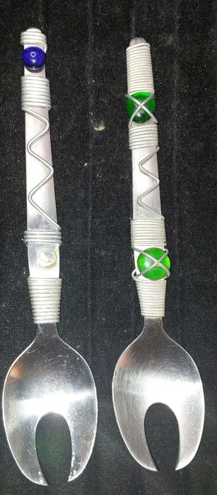 A PAIR STAINLESS STEEL SALAD LADELS SOLD AS IS