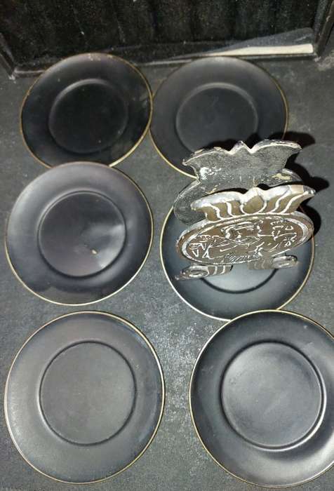 A VINTAGE SET EGYPTIAN PHAROAH BLACK ON BRASS COASTERS