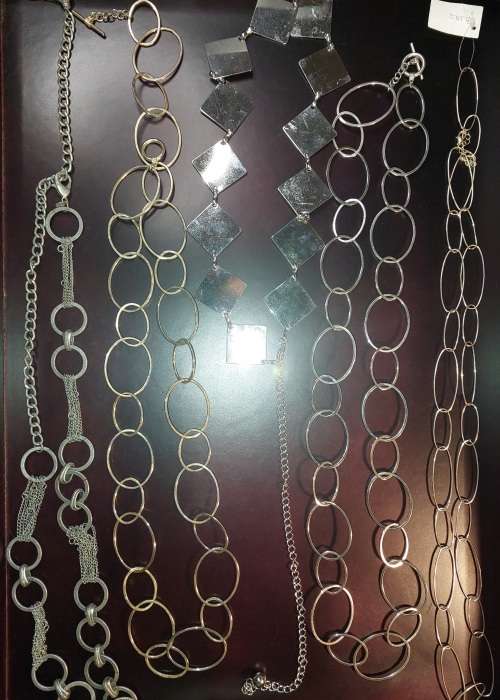 A COLLECTION OF FASHION CHAIN BELTS SOLD AS IS