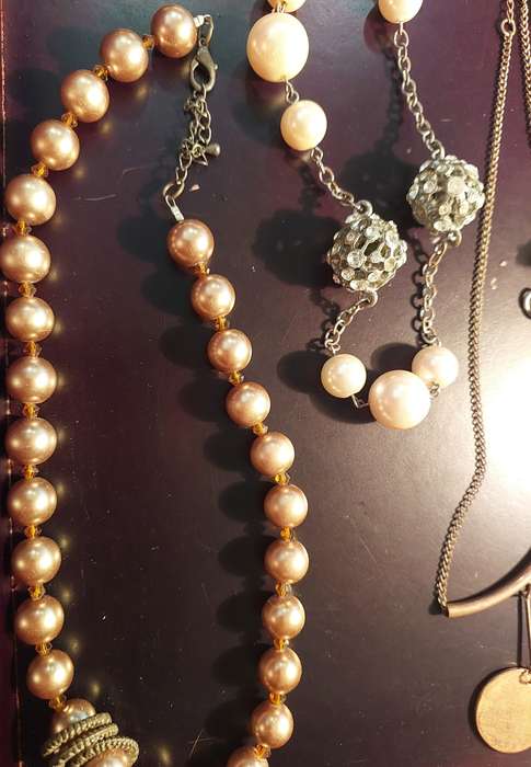 A VINTAGE COLLECTION OF COSTUME NECKLACES SOLD AS IS