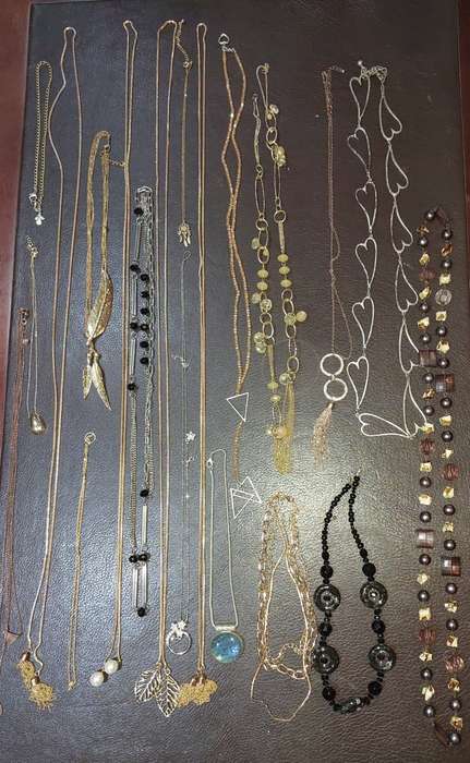 A  VINTAGE COLLECTION OF GOLD PLATED AND SILVER PLATED NECKLACES