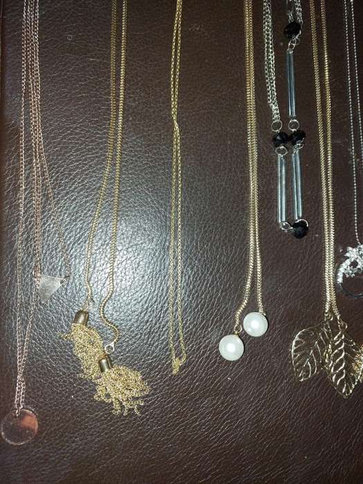 A  VINTAGE COLLECTION OF GOLD PLATED AND SILVER PLATED NECKLACES