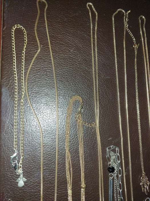 A  VINTAGE COLLECTION OF GOLD PLATED AND SILVER PLATED NECKLACES
