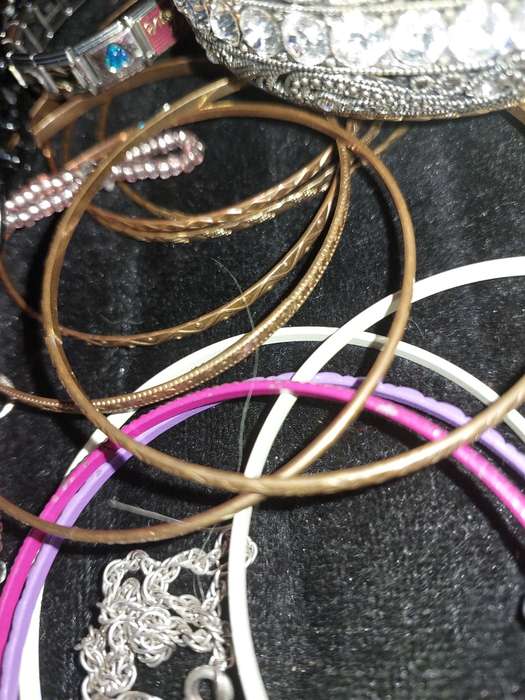 A BULK VINTAGE COLLECTION OF BRACELETS AND BANGLES SOLD AS IS