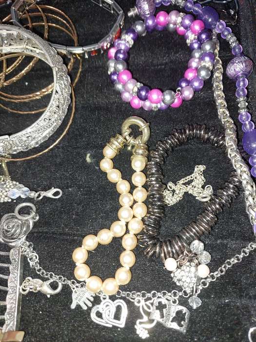 A BULK VINTAGE COLLECTION OF BRACELETS AND BANGLES SOLD AS IS