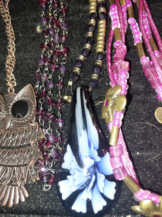 A BULK COLLECTION OF COSTUME JEWELRY AND THE PLASTIC CASES SOLD AS IS