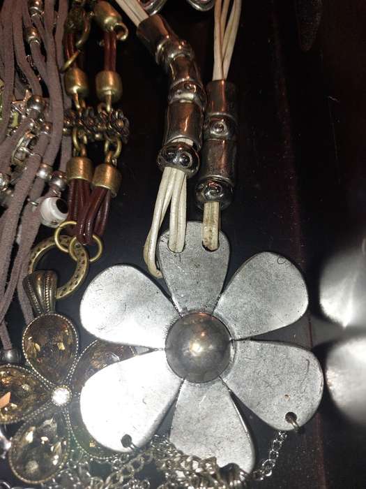 A BULK COLLECTION OF COSTUME JEWELRY AND THE PLASTIC CASES SOLD AS IS