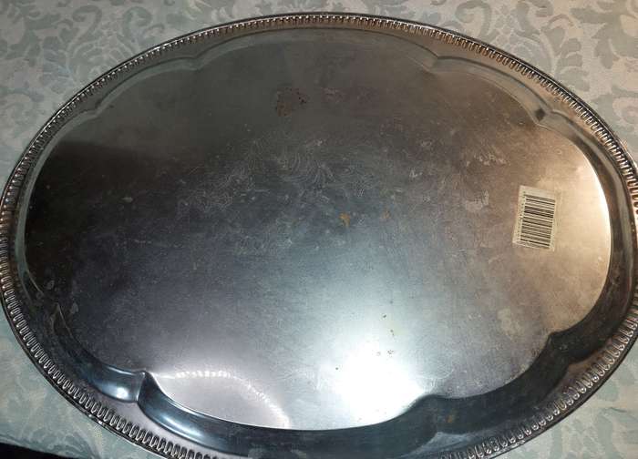 A VINTAGE STAINLESS STEEL SERVING TRAY NEEDS POLISHING
