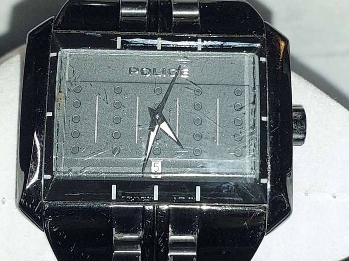 A MENS POLICE RECTANGULAR BLACK ENAMEL WRISTWATCH