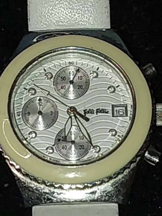 A FOLLI FOLLIE WITH WHITE ENEMAL BAZEL D/D AND WHITE LEATHER BAND