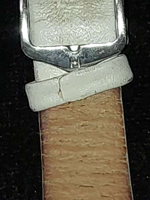 A FOLLI FOLLIE WITH WHITE ENEMAL BAZEL D/D AND WHITE LEATHER BAND
