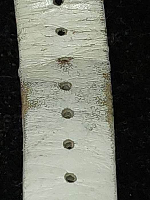 A FOLLI FOLLIE WITH WHITE ENEMAL BAZEL D/D AND WHITE LEATHER BAND