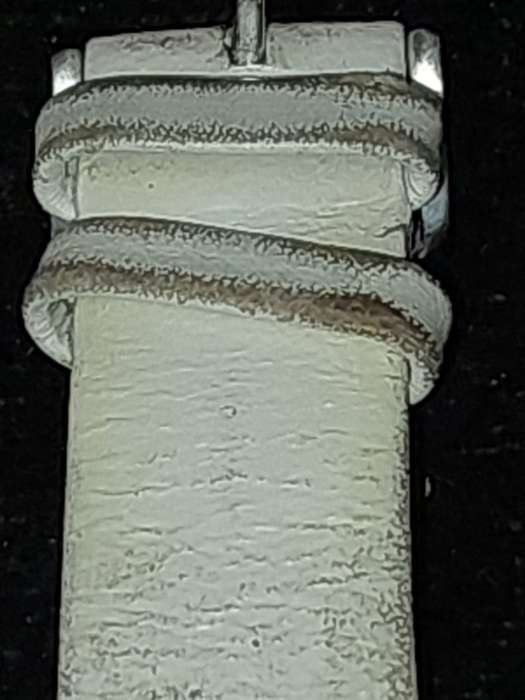 A FOLLI FOLLIE WITH WHITE ENEMAL BAZEL D/D AND WHITE LEATHER BAND