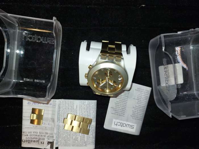 A VINTAGE SWATCH DIAPHANE CHRONO GOLD PLATED WITH EXTRA LINKS AND ALL PAPERS (WORKING)