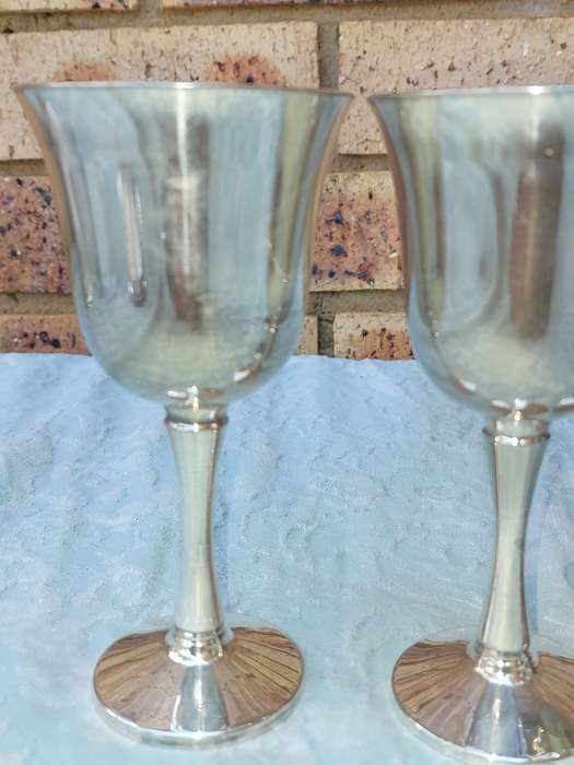 A SET OF FOUR WINE FLUTES SILVER PLATED