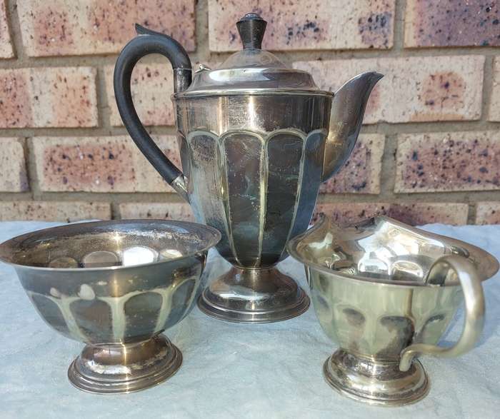 AN ANTIQUE EPNS TEA JUG SET