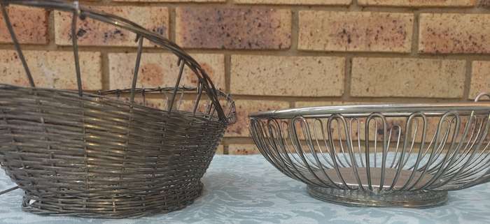 TWO VINTAGE STAINLESS STEEL WIRE MESH FRUIT BASKETS